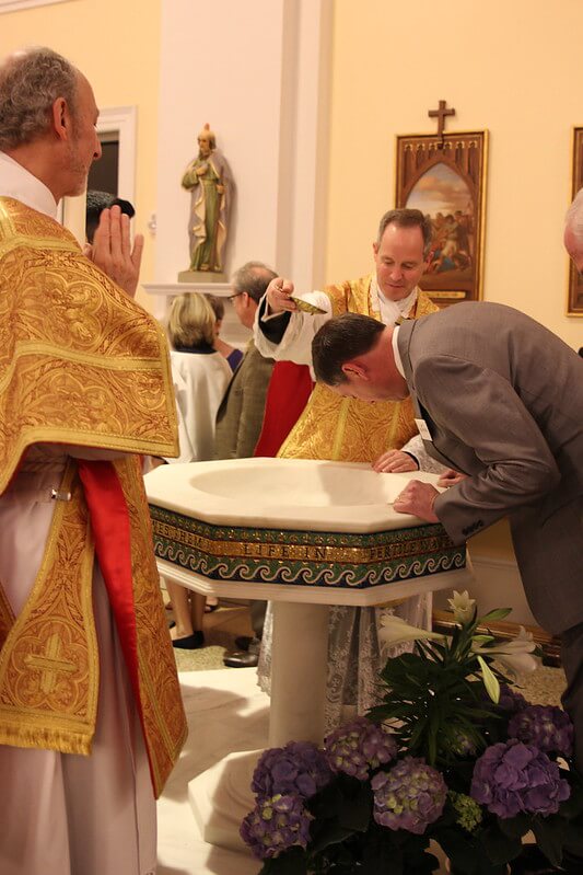 Adult baptism. Photo credit: SueAnn Howell, Catholic News Herald