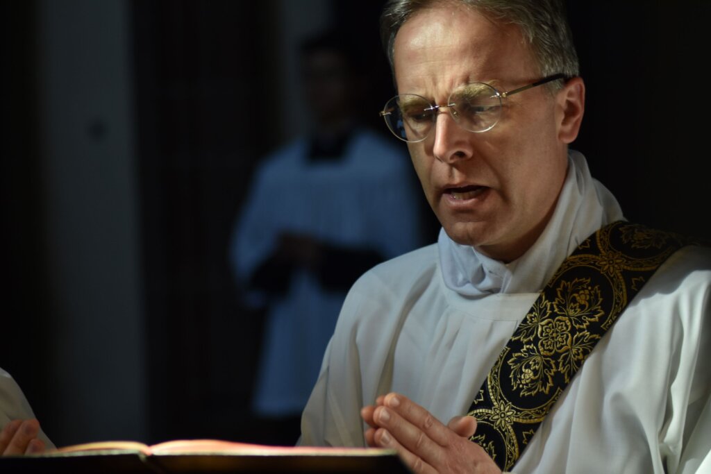 Fr. de Malleray singing the Passion on Good Friday (photo by Joachim Kahn)